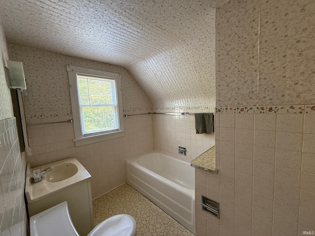 502 Keller St, North Judson, IN 46366 - full bathroom featuring tile walls, a garden tub, vanity, wainscoting, and lofted ceiling