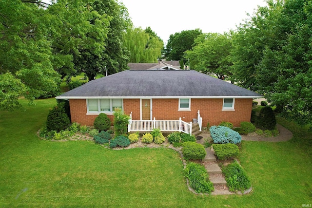 501 E Ulen St, Fort Branch, IN 47648 - back of house featuring roof with shingles, brick siding, and a yard