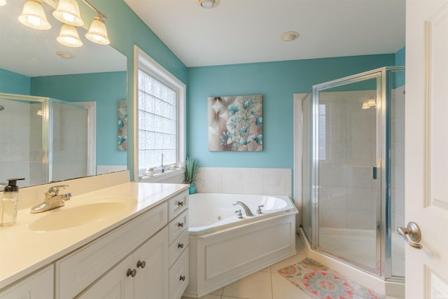 9142 Hartwell Dr, Evansville, IN 47725 - full bathroom featuring tile patterned floors, a shower stall, vanity, and a whirlpool tub