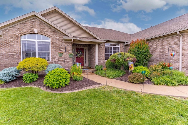 9142 Hartwell Dr, Evansville, IN 47725 - single story home with a front lawn, brick siding, and roof with shingles