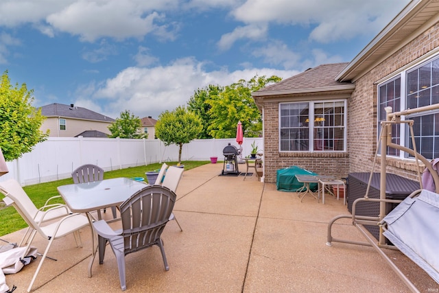 9142 Hartwell Dr, Evansville, IN 47725 - fenced backyard with a patio and outdoor dining area