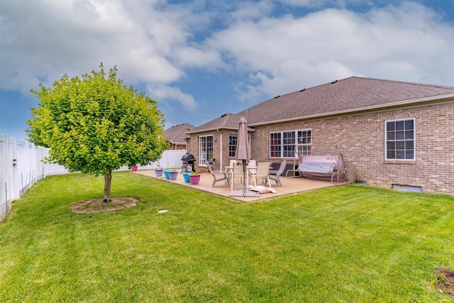 9142 Hartwell Dr, Evansville, IN 47725 - rear view of house with brick siding, roof with shingles, and a patio