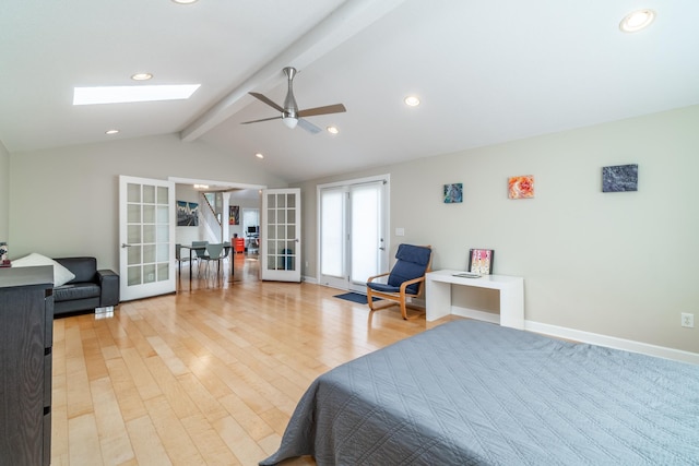 3513 Crater Cv, Fort Wayne, IN 46804 - bedroom featuring french doors, a skylight, light wood-style floors, ceiling fan, and baseboards