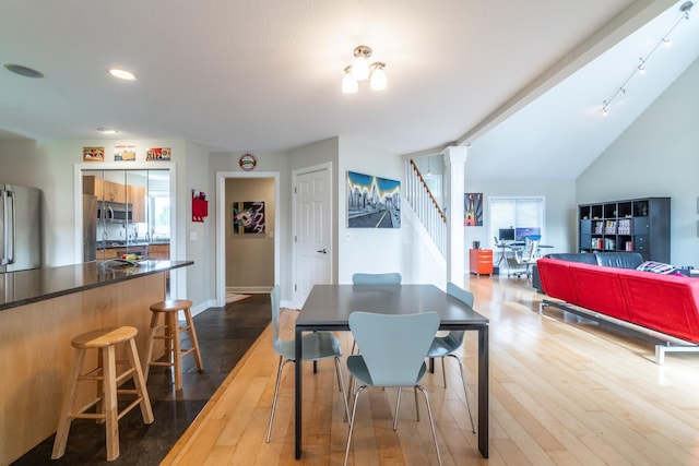 3513 Crater Cv, Fort Wayne, IN 46804 - dining space featuring hardwood / wood-style floors, ornate columns, stairway, recessed lighting, and baseboards