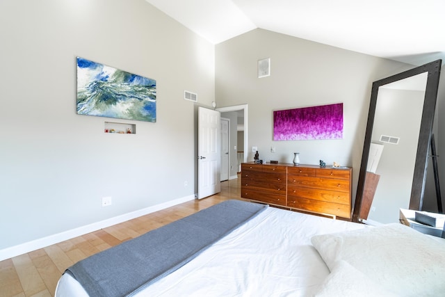 3513 Crater Cv, Fort Wayne, IN 46804 - bedroom with light wood-type flooring, baseboards, and high vaulted ceiling
