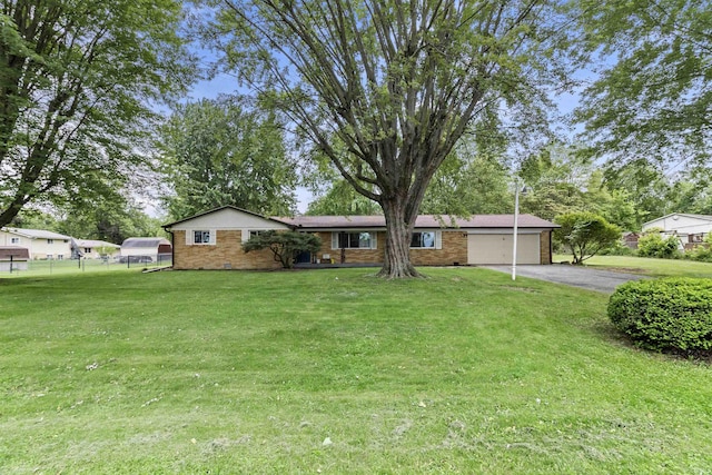 1875 N Michael Dr, Marion, IN 46952 - ranch-style home featuring asphalt driveway, an attached garage, and brick siding