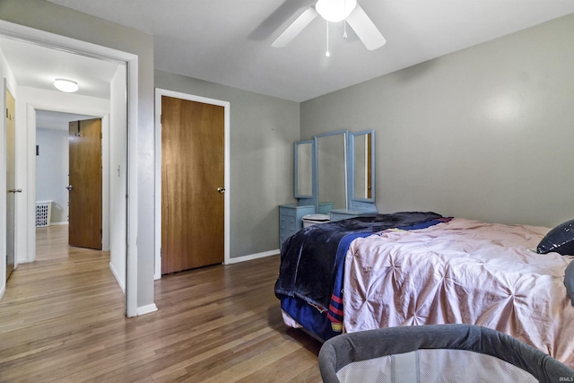 1875 N Michael Dr, Marion, IN 46952 - bedroom featuring wood finished floors, baseboards, and ceiling fan