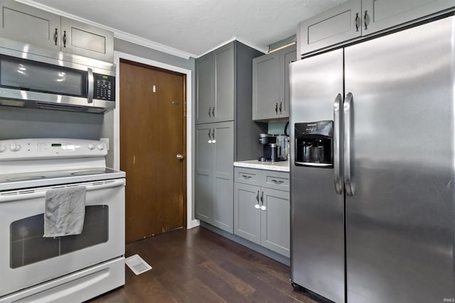 1875 N Michael Dr, Marion, IN 46952 - kitchen with appliances with stainless steel finishes, gray cabinetry, dark wood-style floors, ornamental molding, and light countertops