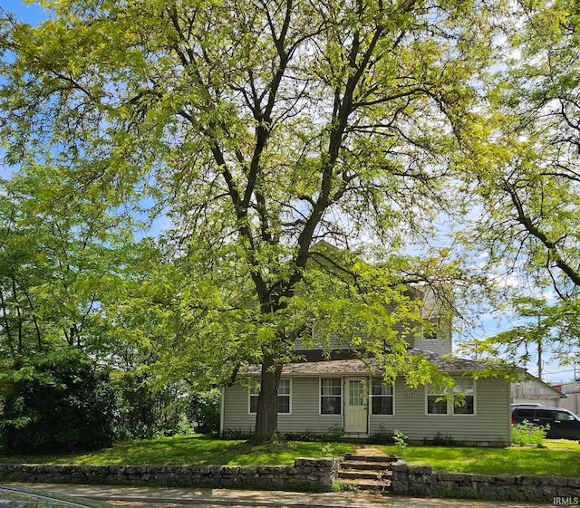 115 High St, Geneva, IN 46740 - view of property hidden behind natural elements with a front yard