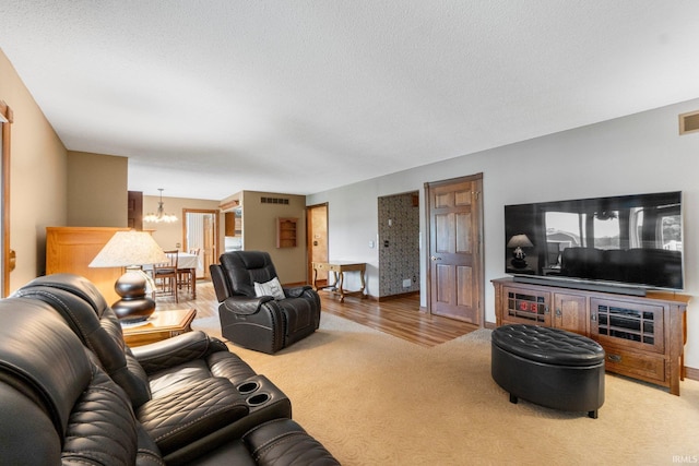 7800 E 400 S-92, Fort Wayne, IN 46818 - carpeted living room featuring a chandelier, a textured ceiling, and baseboards