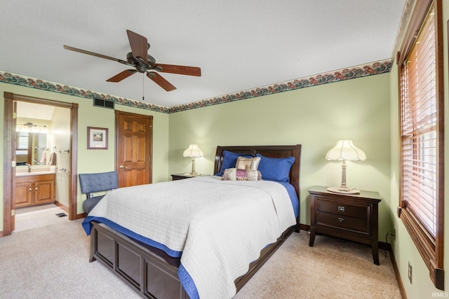 7800 E 400 S-92, Fort Wayne, IN 46818 - bedroom with light carpet, ensuite bathroom, ceiling fan, and baseboards
