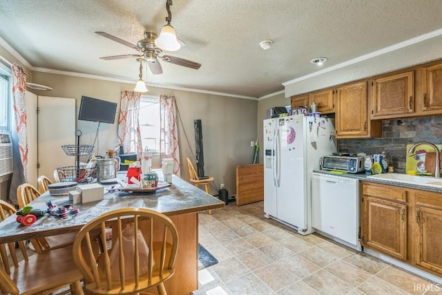 718 Center St, New Haven, IN 46774 - kitchen with white appliances, a sink, a ceiling fan, brown cabinets, and decorative backsplash