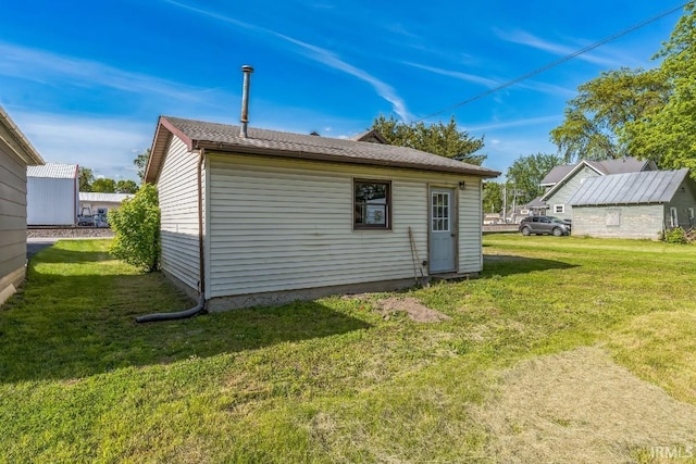 718 Center St, New Haven, IN 46774 - rear view of house with a yard