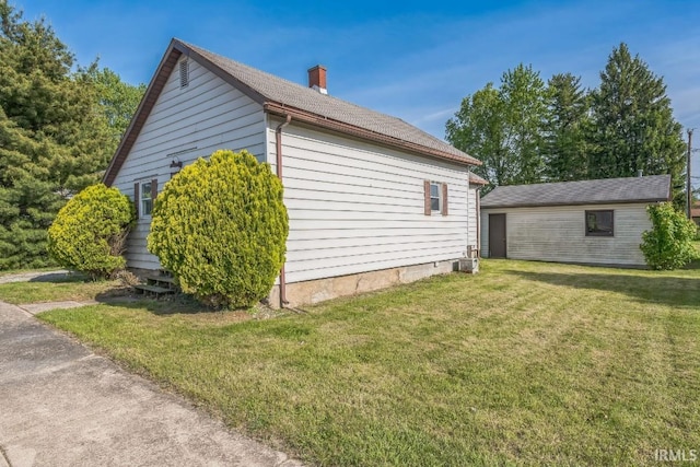 718 Center St, New Haven, IN 46774 - view of property exterior featuring a lawn, a chimney, and cooling unit