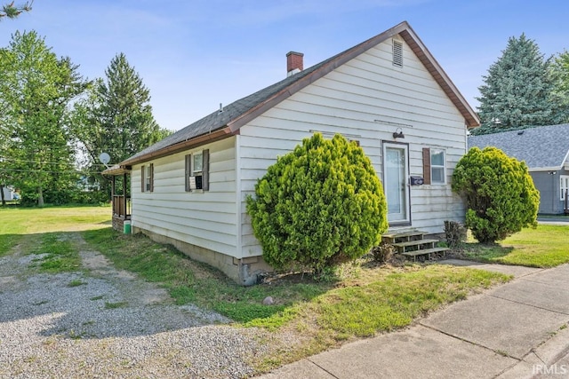 718 Center St, New Haven, IN 46774 - view of home's exterior featuring entry steps and a chimney