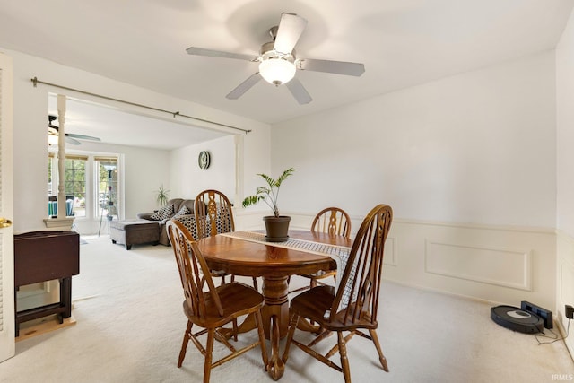 405 Inglenook Pl, Angola, IN 46703 - dining space with a ceiling fan, light colored carpet, and wainscoting