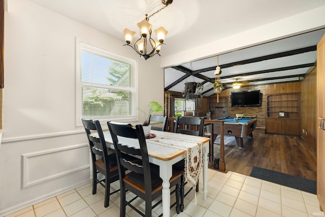 405 Inglenook Pl, Angola, IN 46703 - dining room featuring wooden walls, a chandelier, pool table, a ceiling fan, and tile patterned floors