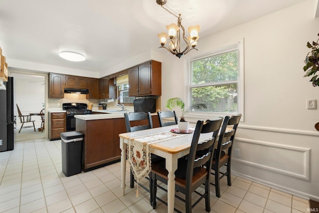 405 Inglenook Pl, Angola, IN 46703 - dining area with a chandelier and light tile patterned flooring