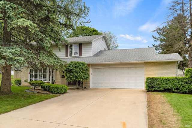 405 Inglenook Pl, Angola, IN 46703 - view of front of house with brick siding, concrete driveway, a garage, a front yard, and a shingled roof