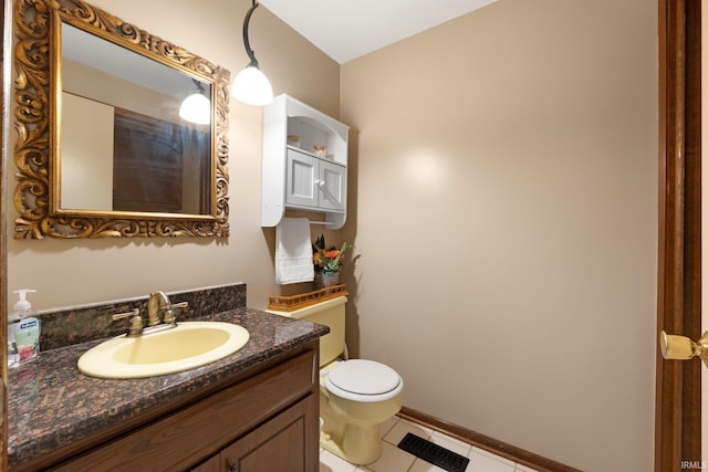 405 Inglenook Pl, Angola, IN 46703 - bathroom featuring toilet, tile patterned flooring, and vanity