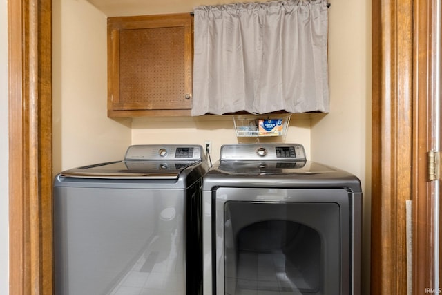 405 Inglenook Pl, Angola, IN 46703 - washroom featuring cabinet space and separate washer and dryer
