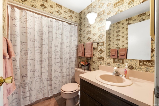 405 Inglenook Pl, Angola, IN 46703 - full bath with wallpapered walls, vanity, toilet, and a shower with shower curtain