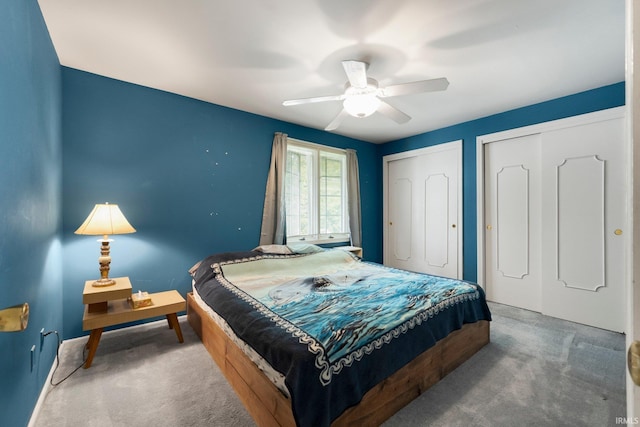 405 Inglenook Pl, Angola, IN 46703 - carpeted bedroom with multiple closets and a ceiling fan