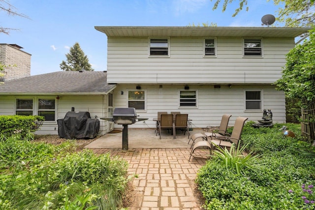 405 Inglenook Pl, Angola, IN 46703 - back of property with a patio area and outdoor dining area