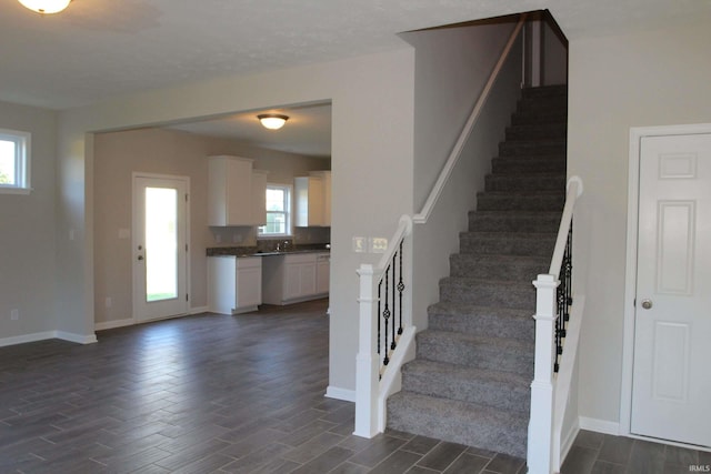 1006 E Brandy Blvd, Ellettsville, IN 47429 - stairs featuring wood finished floors and baseboards