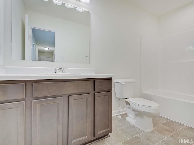 1006 E Brandy Blvd, Ellettsville, IN 47429 - bathroom with vanity, toilet, baseboards, and bathtub / shower combination