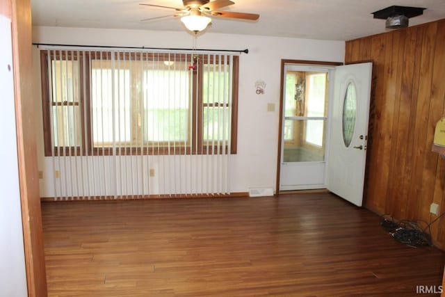 4283 E Ramp Creek Rd, Bloomington, IN 47401 - entrance foyer featuring a ceiling fan, wood finished floors, baseboards, and wood walls