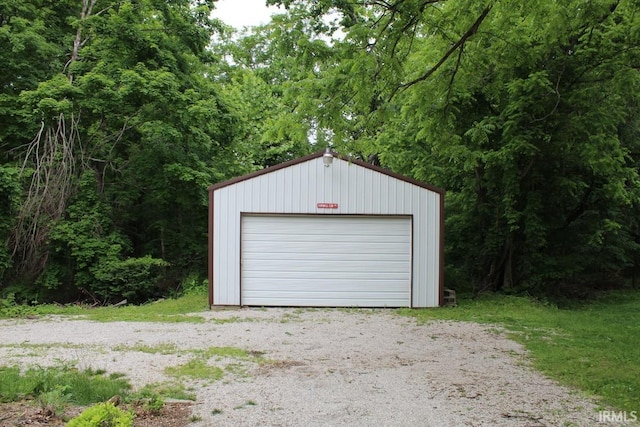 4283 E Ramp Creek Rd, Bloomington, IN 47401 - detached garage featuring a wooded view