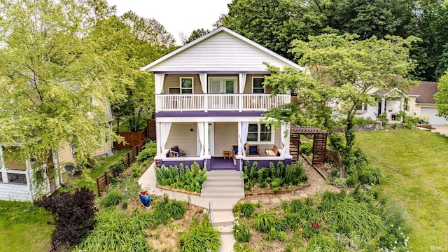 413 Lingle Ave, Lafayette, IN 47901 - view of front facade featuring stairway, a balcony, a front lawn, and a porch