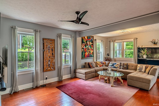 413 Lingle Ave, Lafayette, IN 47901 - living area with healthy amount of natural light, a textured ceiling, wood-type flooring, and baseboards