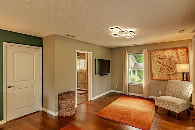 413 Lingle Ave, Lafayette, IN 47901 - living area featuring wood finished floors, baseboards, and a textured ceiling