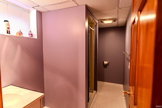413 Lingle Ave, Lafayette, IN 47901 - full bathroom featuring a paneled ceiling, a shower stall, vanity, and baseboards