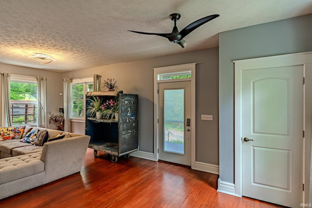 413 Lingle Ave, Lafayette, IN 47901 - living area with wood-type flooring, a textured ceiling, baseboards, and ceiling fan