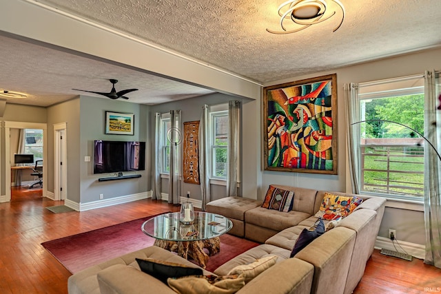 413 Lingle Ave, Lafayette, IN 47901 - living area featuring a textured ceiling, wood finished floors, and baseboards