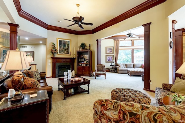 136 Tulip Cir, Bremen, IN 46506 - living room featuring ceiling fan, decorative columns, carpet, a glass covered fireplace, and crown molding