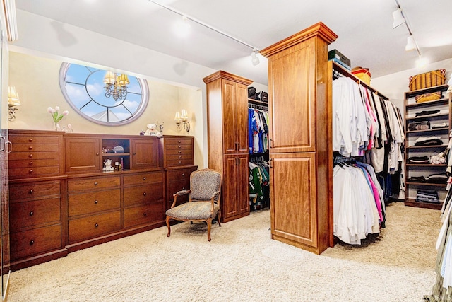 136 Tulip Cir, Bremen, IN 46506 - walk in closet with carpet and a chandelier