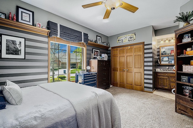 136 Tulip Cir, Bremen, IN 46506 - bedroom featuring light colored carpet, a closet, and ceiling fan