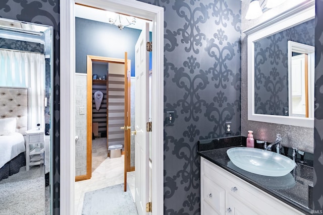 136 Tulip Cir, Bremen, IN 46506 - ensuite bathroom with wallpapered walls and vanity