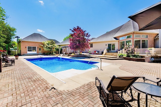 136 Tulip Cir, Bremen, IN 46506 - view of pool with a patio and a jacuzzi
