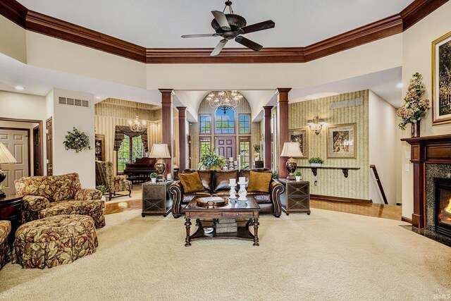 136 Tulip Cir, Bremen, IN 46506 - living area featuring a chandelier, crown molding, carpet, ornate columns, and a high end fireplace