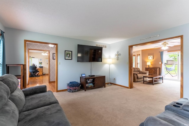 620 Bob Ct, Evansville, IN 47711 - living room with a ceiling fan, baseboards, and carpet flooring