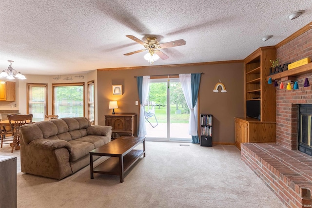620 Bob Ct, Evansville, IN 47711 - living area with a brick fireplace, light colored carpet, a ceiling fan, a textured ceiling, and crown molding