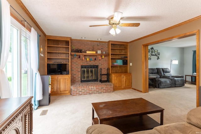 620 Bob Ct, Evansville, IN 47711 - living area featuring light carpet, a ceiling fan, a textured ceiling, ornamental molding, and a brick fireplace