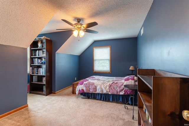 620 Bob Ct, Evansville, IN 47711 - bedroom with a textured ceiling, carpet floors, vaulted ceiling, ceiling fan, and baseboards