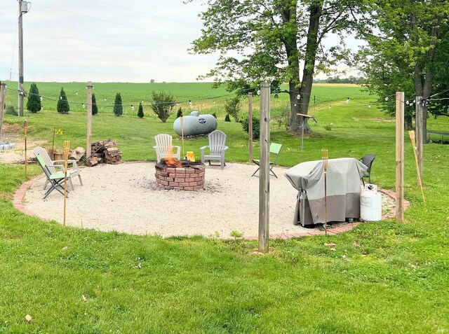3165 E 300 S Rd, Washington, IN 47501 - view of property's community with a fire pit, a yard, and a view of countryside