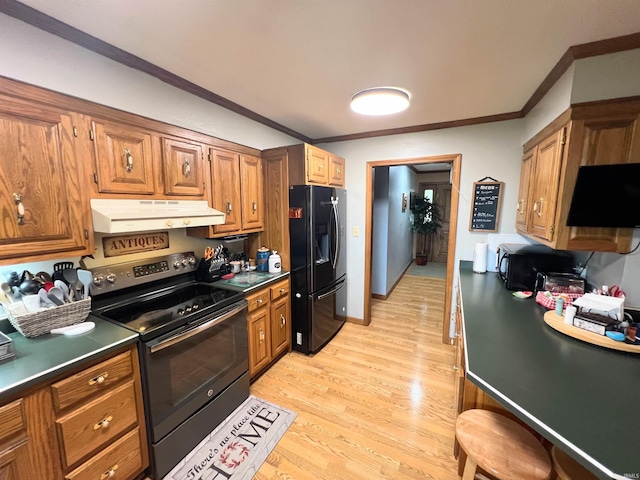3165 E 300 S Rd, Washington, IN 47501 - kitchen featuring black appliances, under cabinet range hood, dark countertops, ornamental molding, and brown cabinets